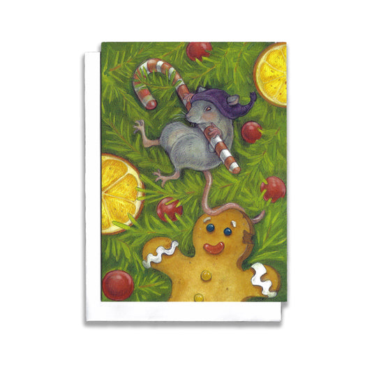 An illustrated Christmas card of a little mouse, wearing apurple cap, swinging from a candy can that is hanging in the tree. A gingerbread man and orange slices decorated the tree.