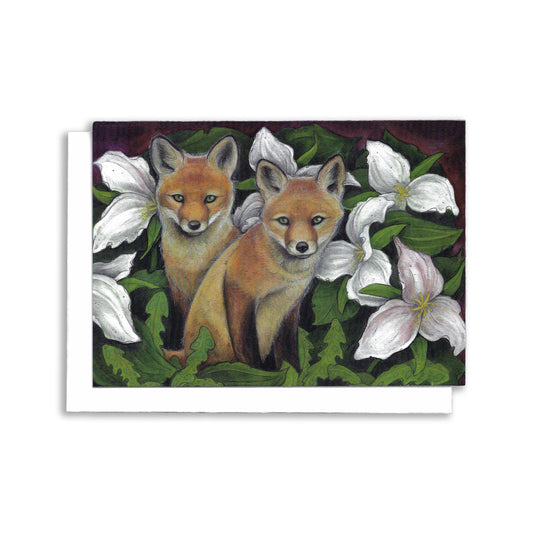 An illustrated greeting card showing two small fox kits in a garden of Giant trilliums