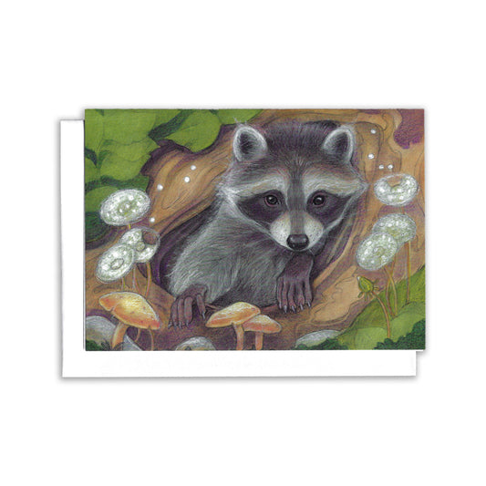 a little raccoon peeks out from a hole in a log. Surrounded by mushrooms and dandelions.